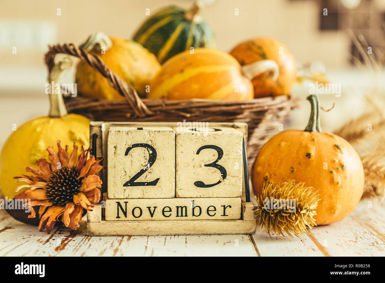 Thanksgiving concept - calendar date with decorations and pumpkins on  kitchen background Stock Photo - Alamy