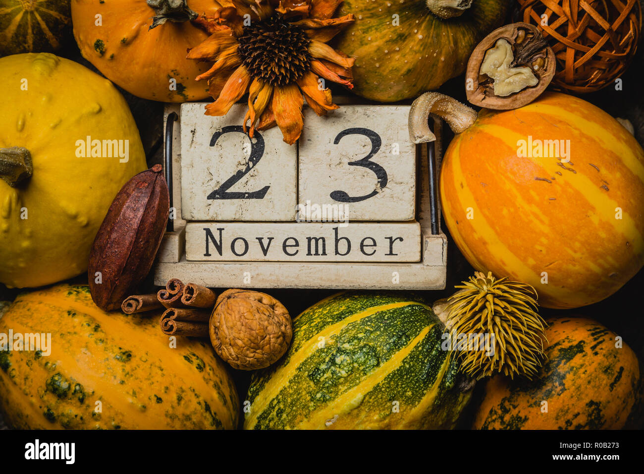 Thanksgiving concept - calendar date with decorations and pumpkins on  kitchen background Stock Photo - Alamy
