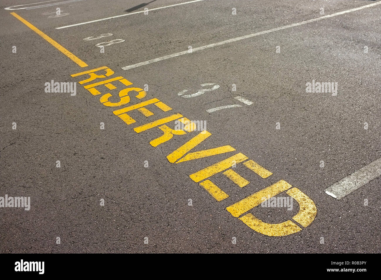 Reserved marking for reserved parking spots. Stock Photo