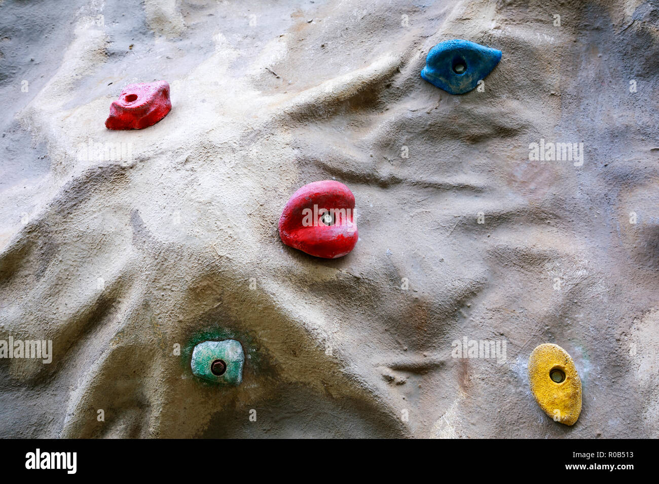 Detail of artificial climbing wall with different sized grips Stock Photo