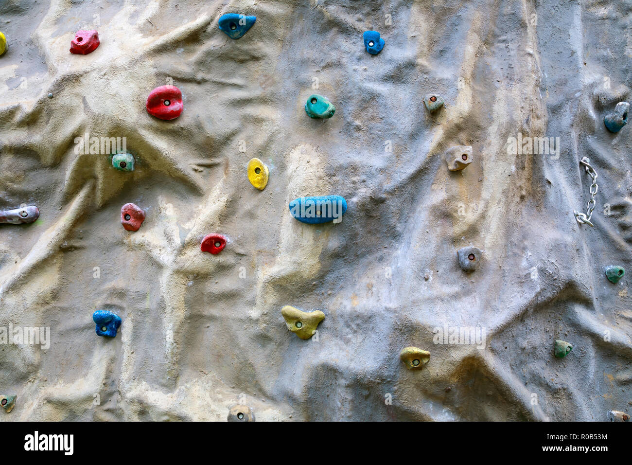 Artificial climbing wall with different sized grips Stock Photo