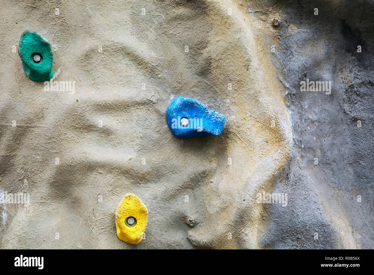 Detail of artificial climbing wall with different sized grips Stock Photo
