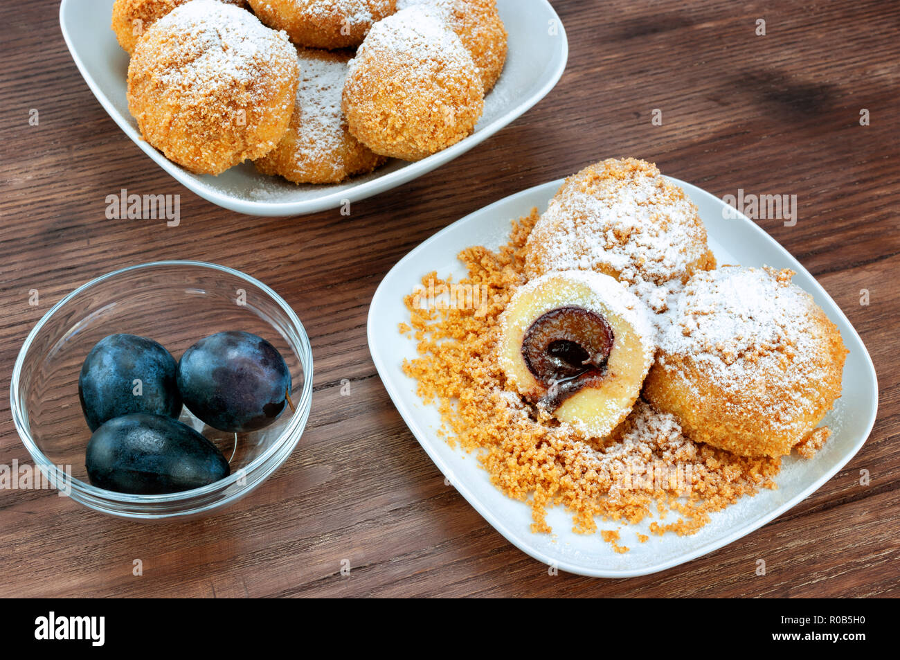 Plum dumplings on wooden table Stock Photo