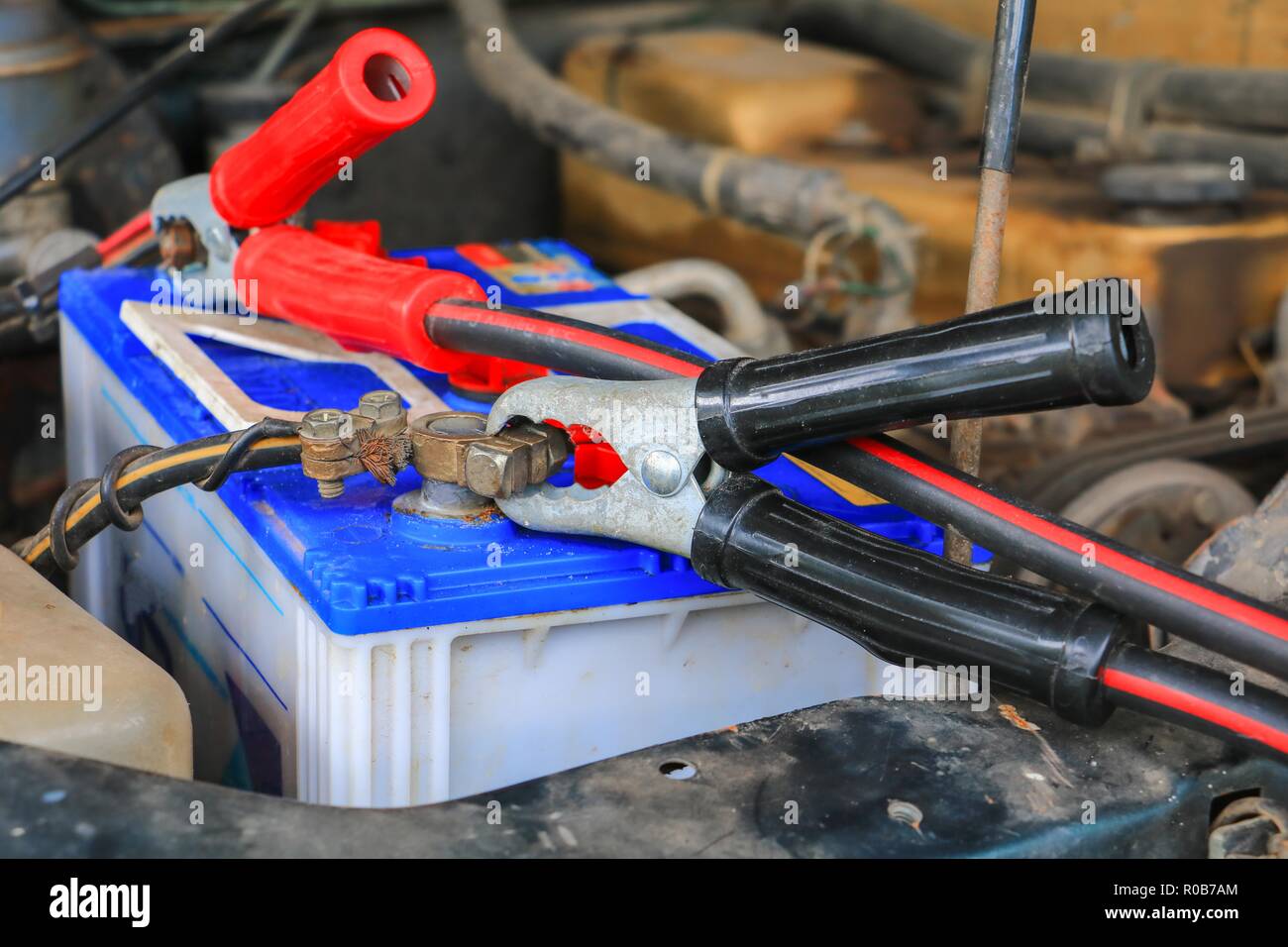 Jumper cable, car battery with red and black Stock Photo Alamy