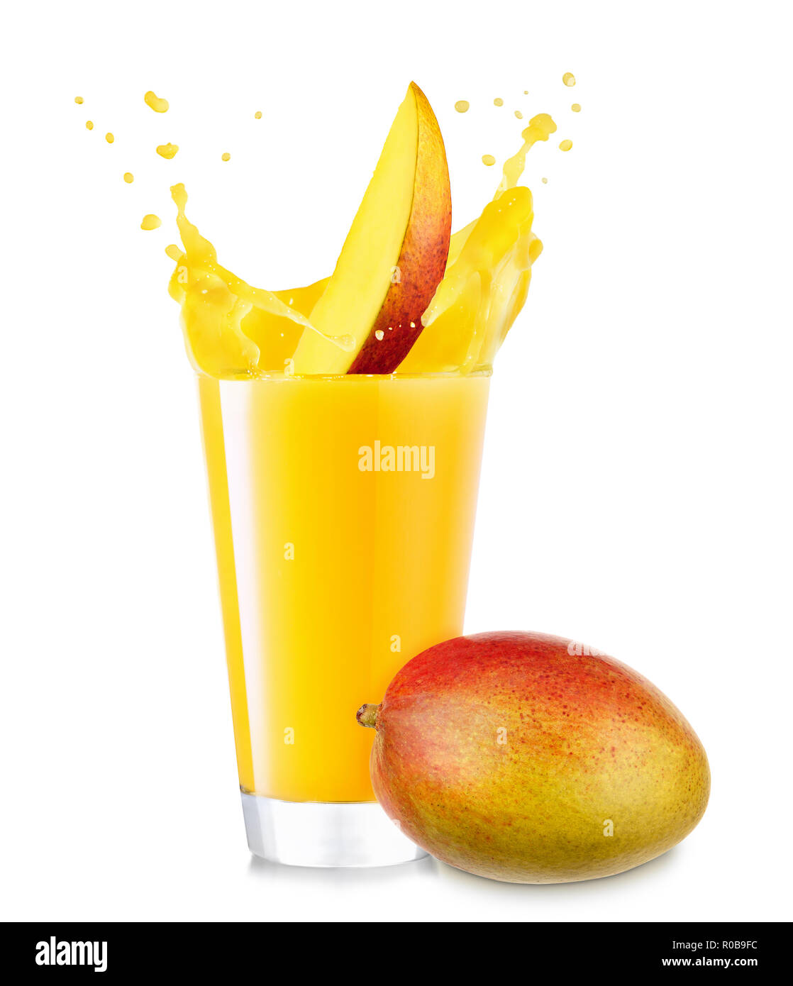 mango juice in glass and fruit near isolated on white background Stock