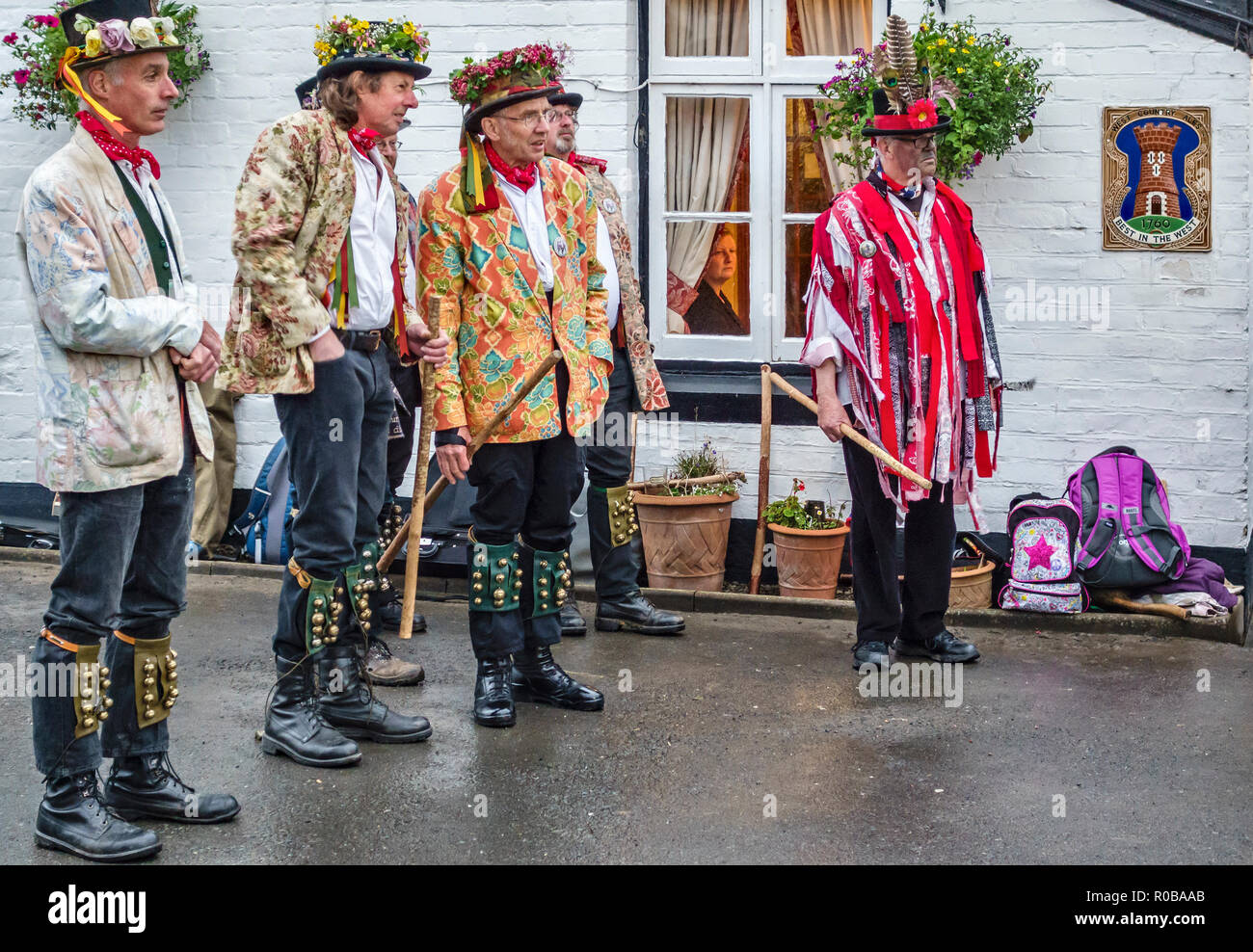 Leominster, Herefordshire, UK. Morris dancers waiting to dance outside the White Lion pub Stock Photo