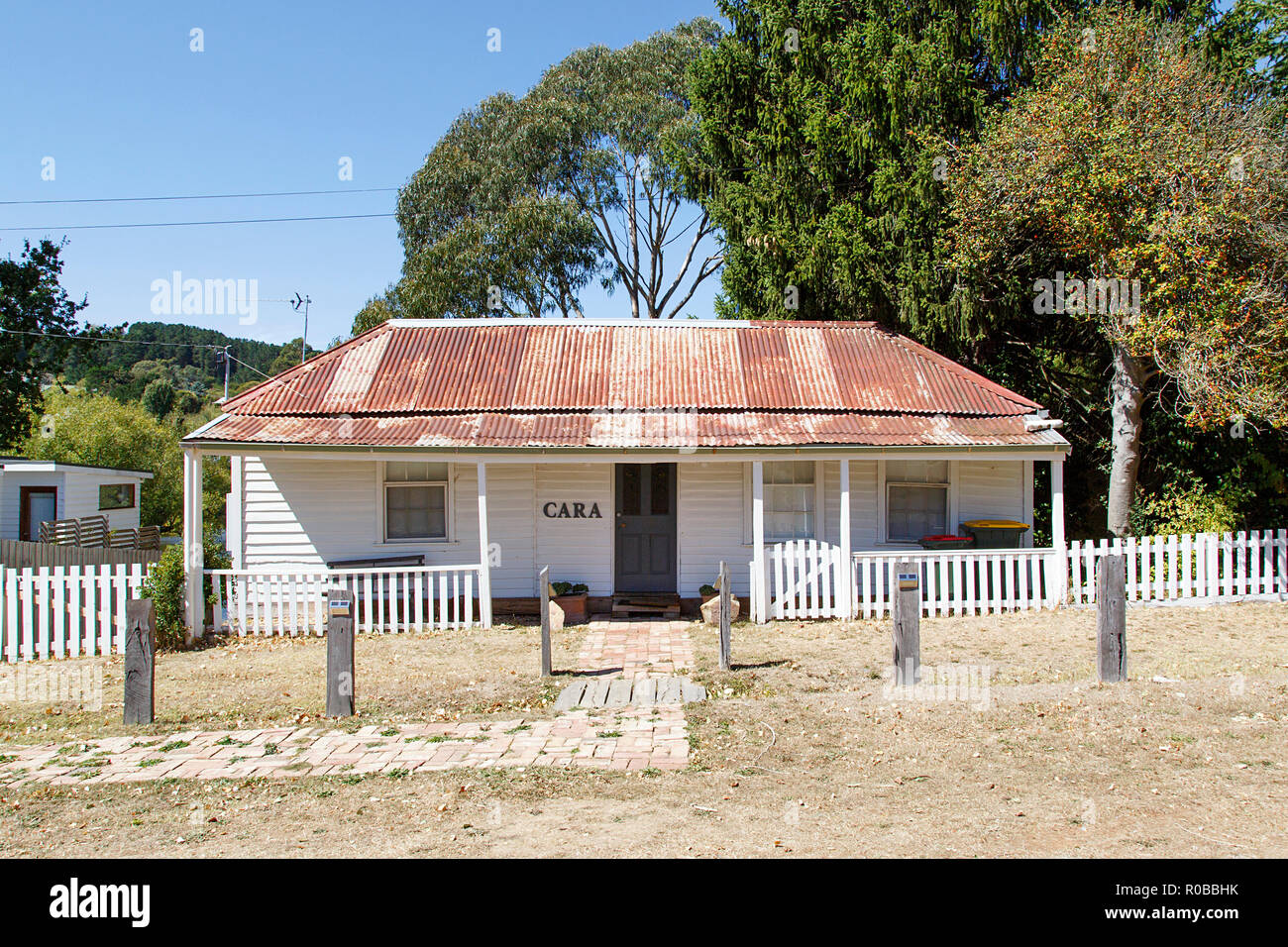 Melbourne, Australia: March 23, 2018: Typical detached double fronted bungalow home with a corrugated roof picket fence and verandah in Daylesford. Stock Photo