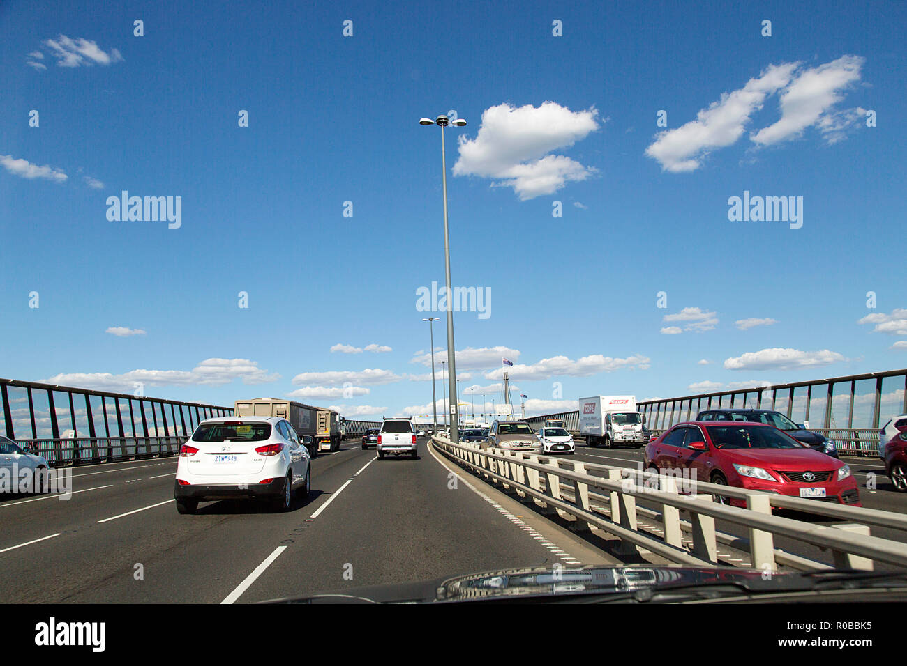 Melbourne, Australia: March 23, 2018: Leaving the M1 Freeway in Melbourne to travel towards the St Kilda area. Road signs and traffic with a blue sky. Stock Photo