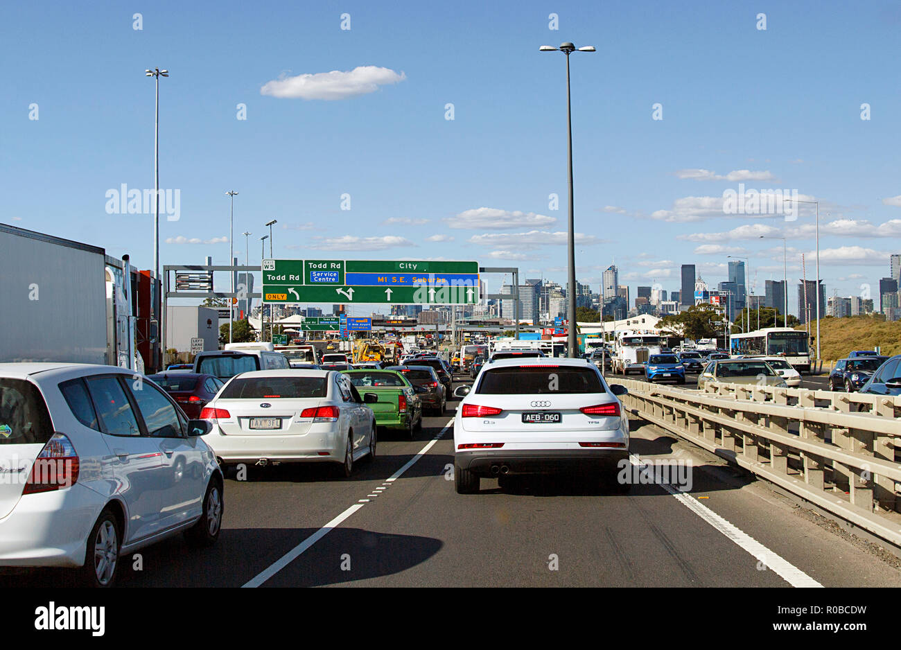 Melbourne, Australia: March 23, 2018: Leaving the M1 Freeway in Melbourne to travel towards the St Kilda area. Road signs and traffic with a blue sky. Stock Photo