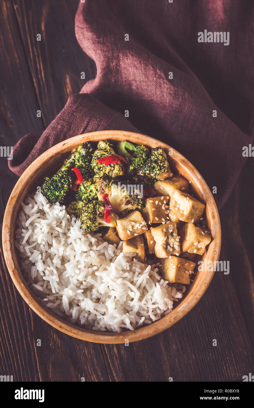 Tofu and broccoli stir-fry with white rice Stock Photo - Alamy