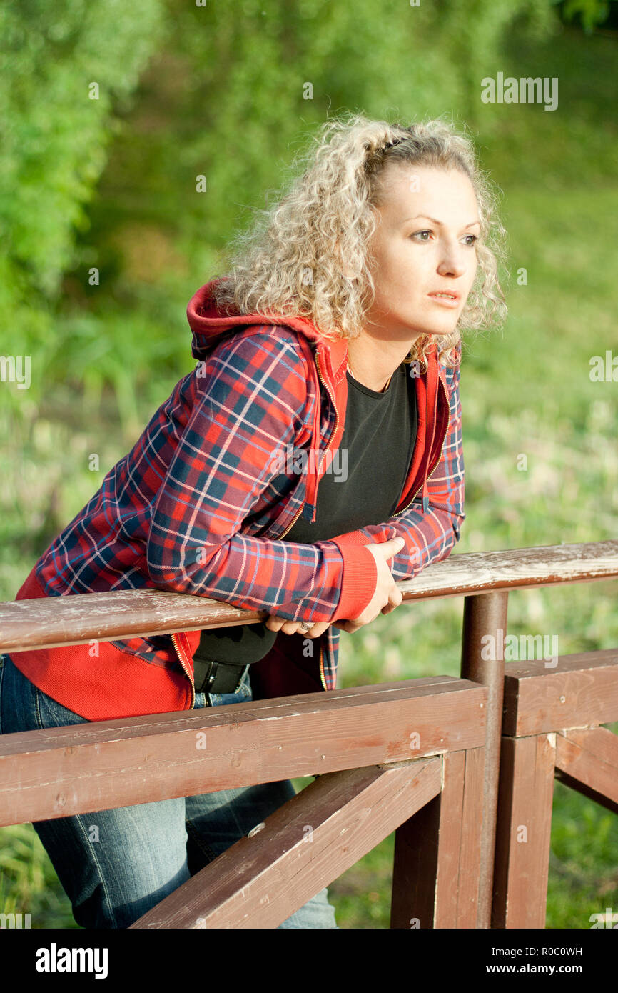 Woman park sad outdoor thoughtful hi-res stock photography and images ...