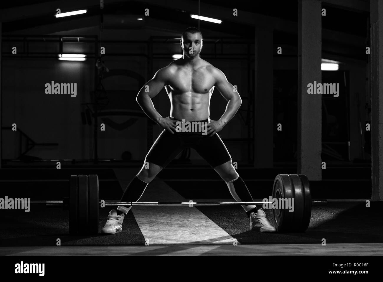 Athlete in the Gym Is Prepared to Perform an Exercise Deadlift Stock Photo
