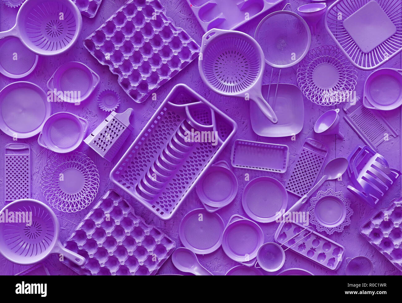 https://c8.alamy.com/comp/R0C1WR/close-up-flat-lay-of-different-purple-violet-color-painted-kitchen-utensils-and-tools-grater-spoon-egg-carton-plastic-disposable-plates-elevated-R0C1WR.jpg