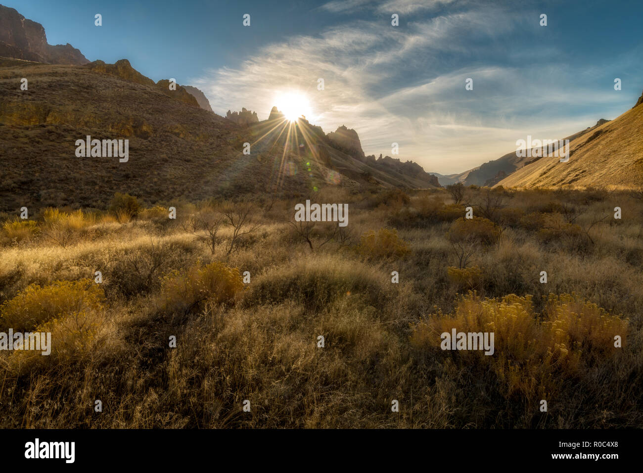 Beautiful canyon with sun rising over the ridge Stock Photo - Alamy