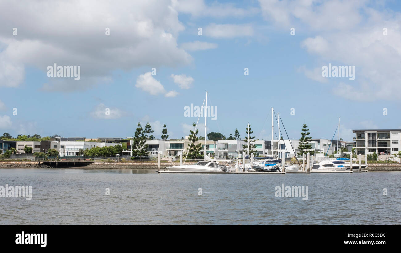 Luxury shoreline housing with moorings,, Brisbane River, Australia