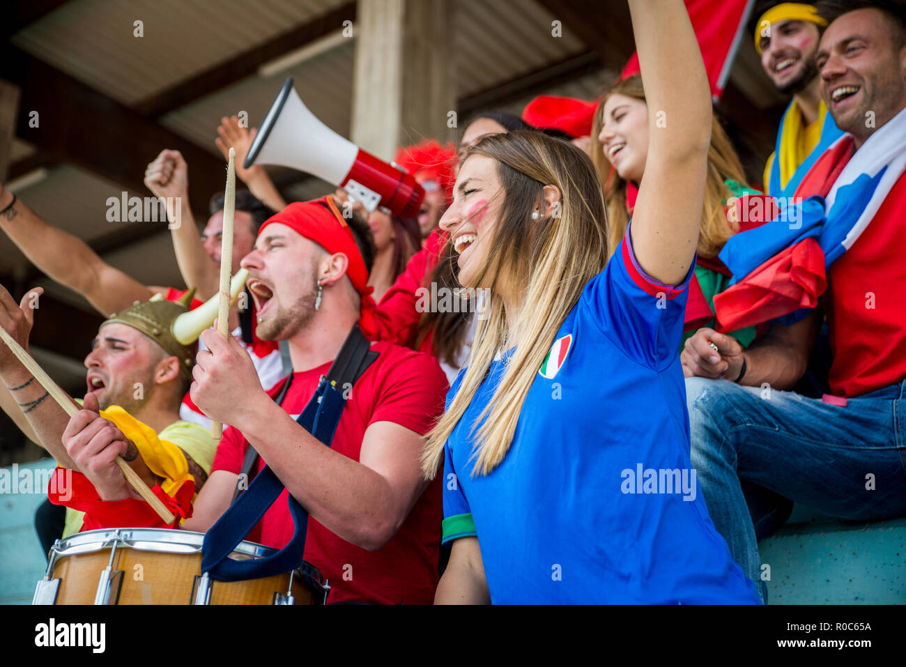 Football supporters at the stadium Football fans having fun and