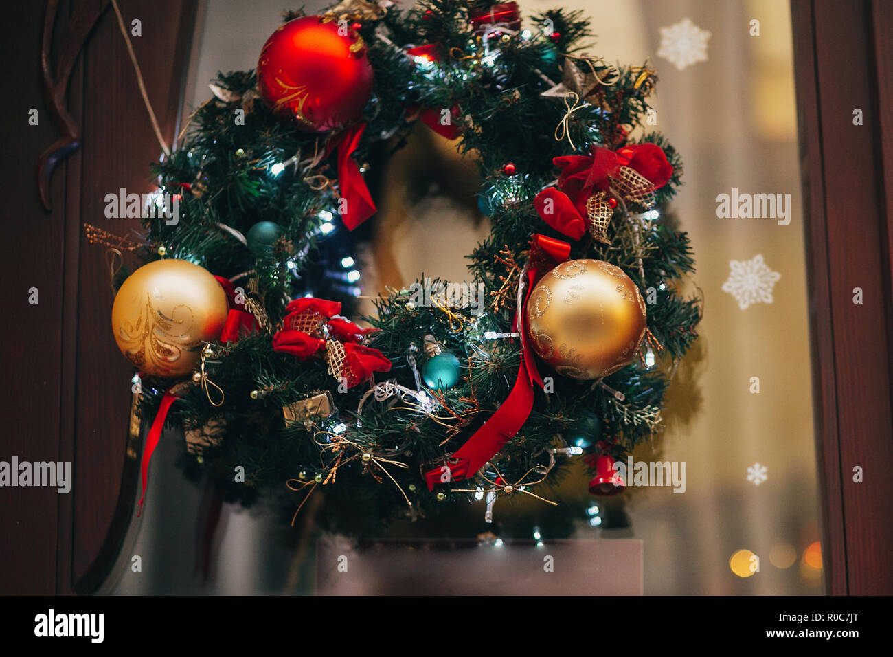 Traditional christmas wreath with red baubles and gold ornaments ...