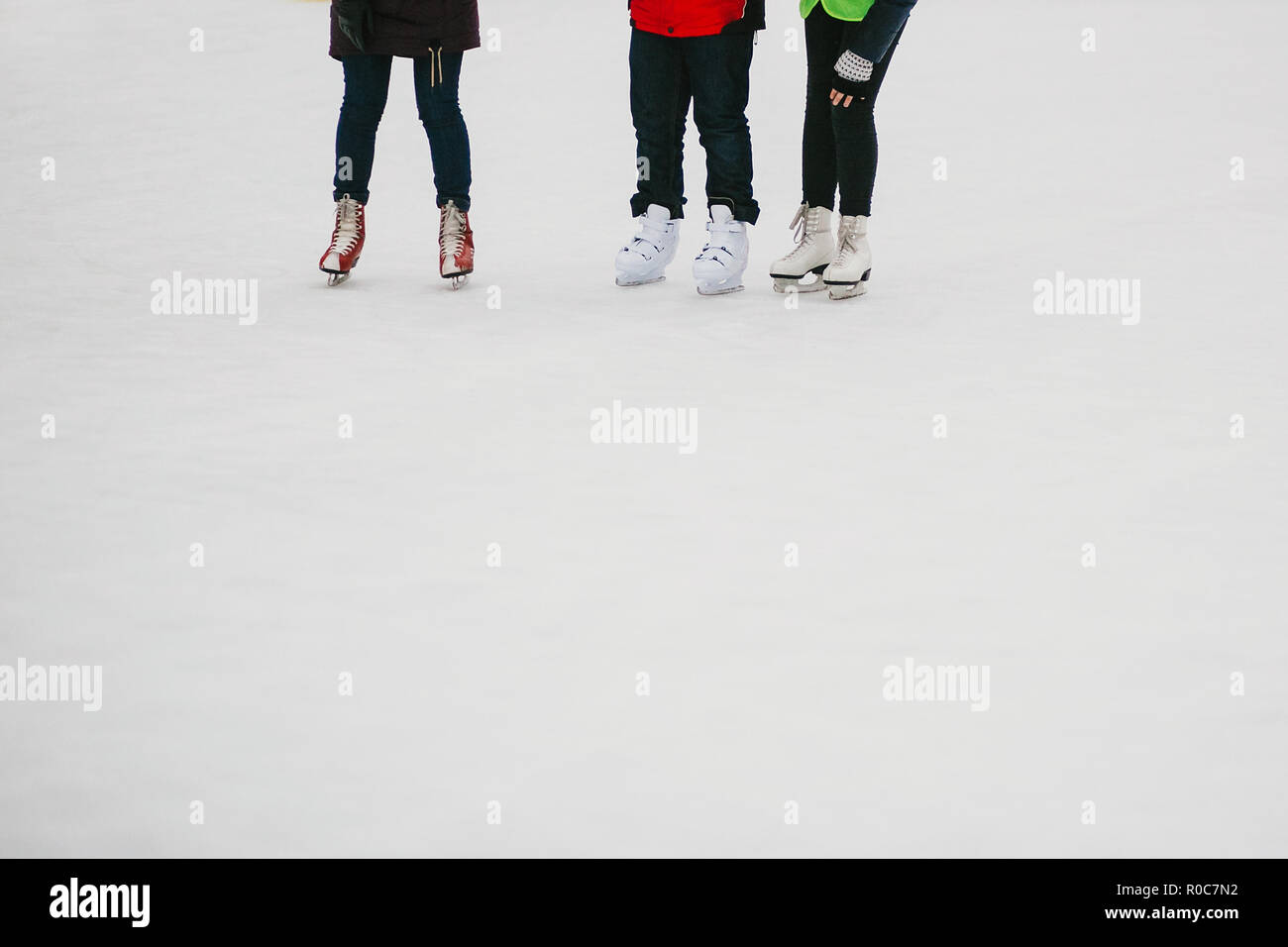 Skaters skating on iceskating ring in european city center in winter