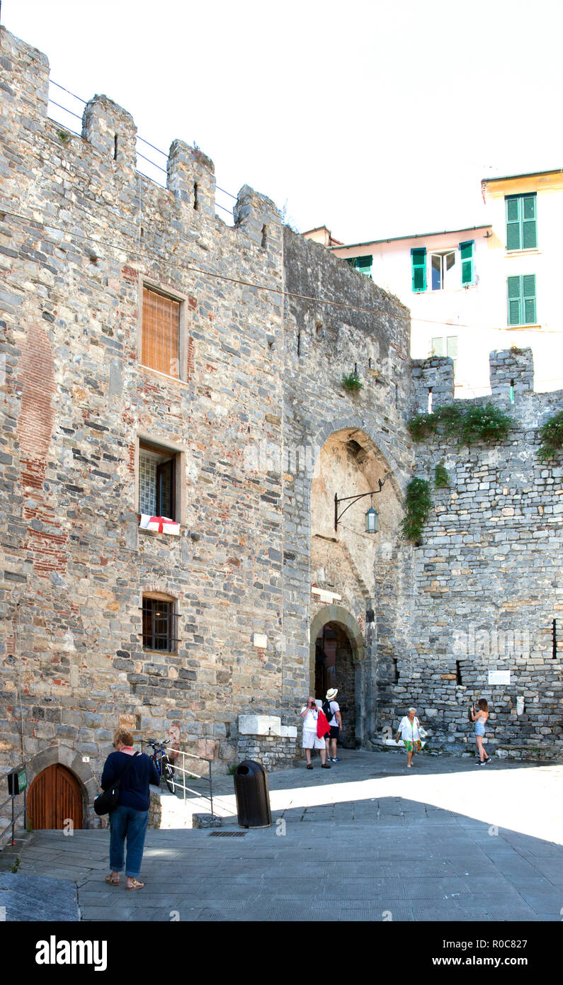 Porta del Borgo (Gate to the City), Portovenere, Italy. This entrance to the village is surrounded by walls dating from 1160 AD.  In the lower left ar Stock Photo