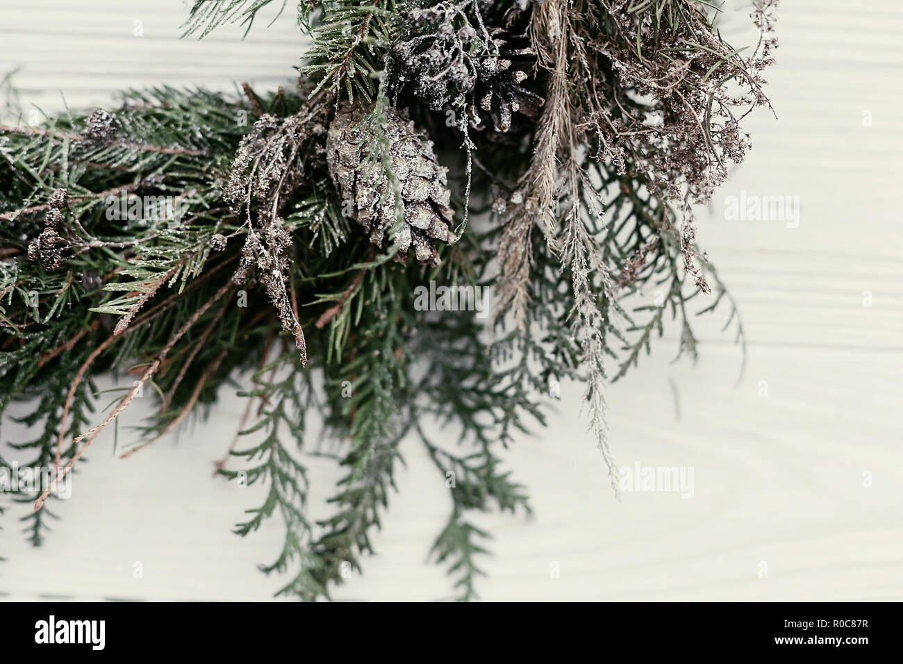 Christmas wreath. stylish rustic christmas wreath on white wooden door ...