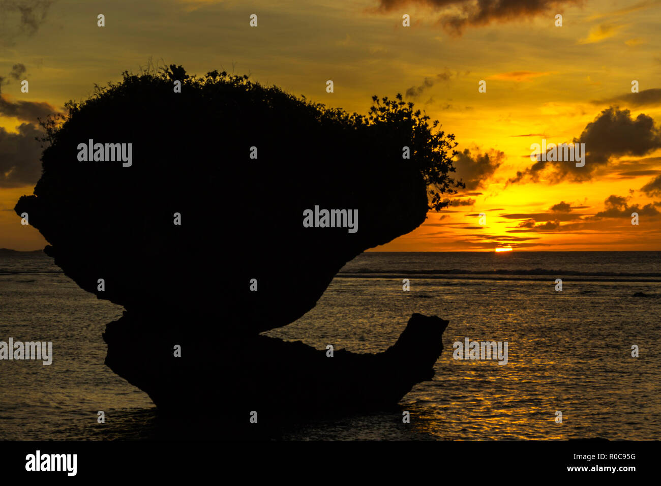 Mushroom rocks during a sunset in Guam. Stock Photo