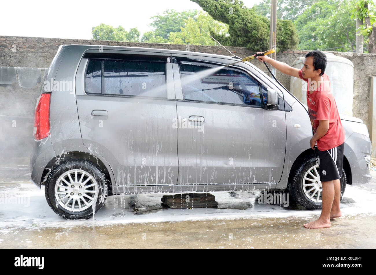 Car wash. Suzuki Karimun Wagon R Stock Photo