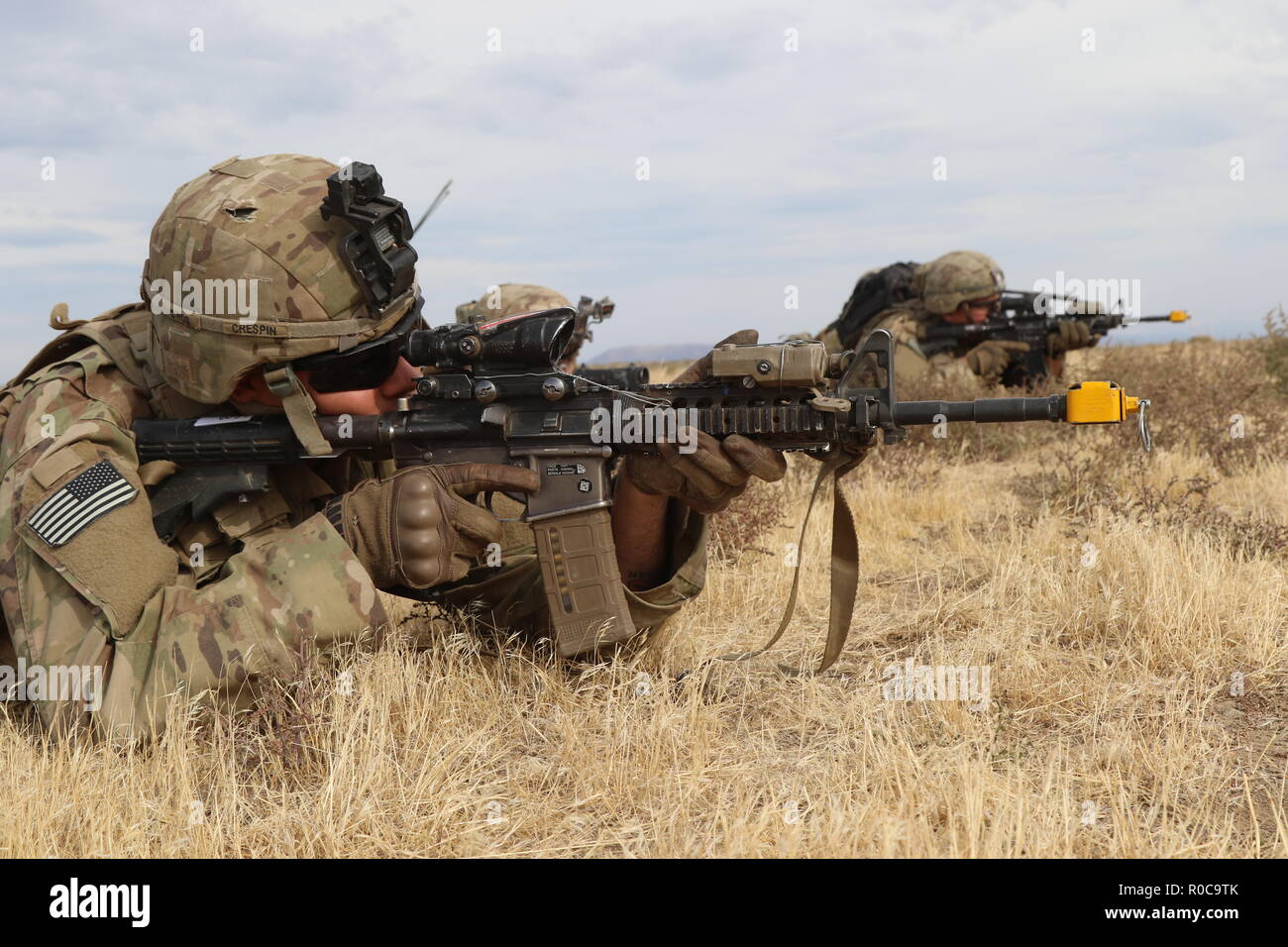 During a Combined Arms Maneuver Live Fire Exercise at Yakima Training Center, Wash, Soldiers from 2nd Battalion, 1st Infantry Regiment, 2nd Stryker Brigade Combat Team, 2nd Infantry Division establish security, Oct. 3, 2018. The U.S. Army is ready to fight tonight. Stock Photo