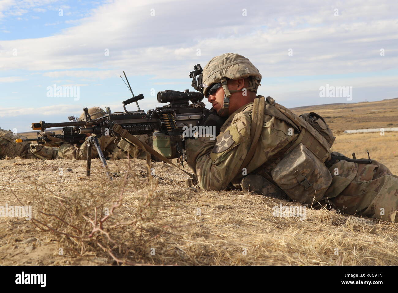 During a Combined Arms Maneuver Live Fire Exercise at Yakima Training Center, Wash., Soldiers from 2nd Battalion, 1st Infantry Regiment, 2nd Stryker Brigade Combat Team, 2nd Infantry Division establish security, Oct. 3, 2018. Stock Photo