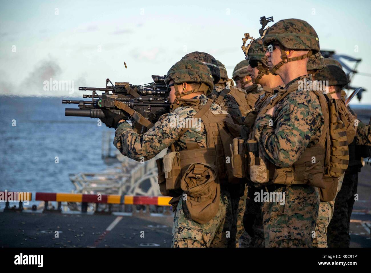 181022-N-KW492-0006 ATLANTIC OCEAN (Oct. 22, 2018) Marines assigned to the 22nd Marine Expeditionary Unit (MEU) conduct a live-fire exercise on the flight deck of the Wasp-class amphibious assault ship USS Kearsarge (LHD3) during the Carrier Strike Group (CSG) 4 composite training unit exercise (COMPTUEX). COMPTUEX is the final pre-deployment exercise that certifies the combined Kearsarge Amphibious Ready Group's and 22nd MEU's abilities to conduct military operations at sea and project power ashore through joint planning and execution of challenging and realistic training scenarios. CSG 4 men Stock Photo