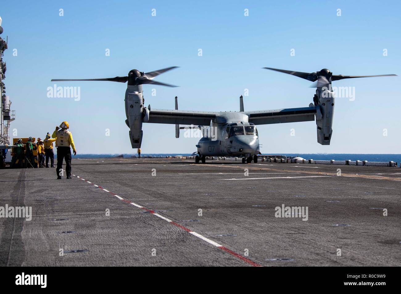 181029-N-KW492-0164 ATLANTIC OCEAN (Oct. 29, 2018) An MV-22 Osprey prepares to take off from the flight deck of the Wasp-class amphibious assault ship USS Kearsarge (LHD3) during the Carrier Strike Group (CSG) 4 composite training unit exercise (COMPTUEX). COMPTUEX is the final pre-deployment exercise that certifies the combined Kearsarge Amphibious Ready Group's and 22nd Marine Expeditionary Unit's abilities to conduct military operations at sea and project power ashore through joint planning and execution of challenging and realistic training scenarios. CSG 4 mentors, trains and assesses Eas Stock Photo