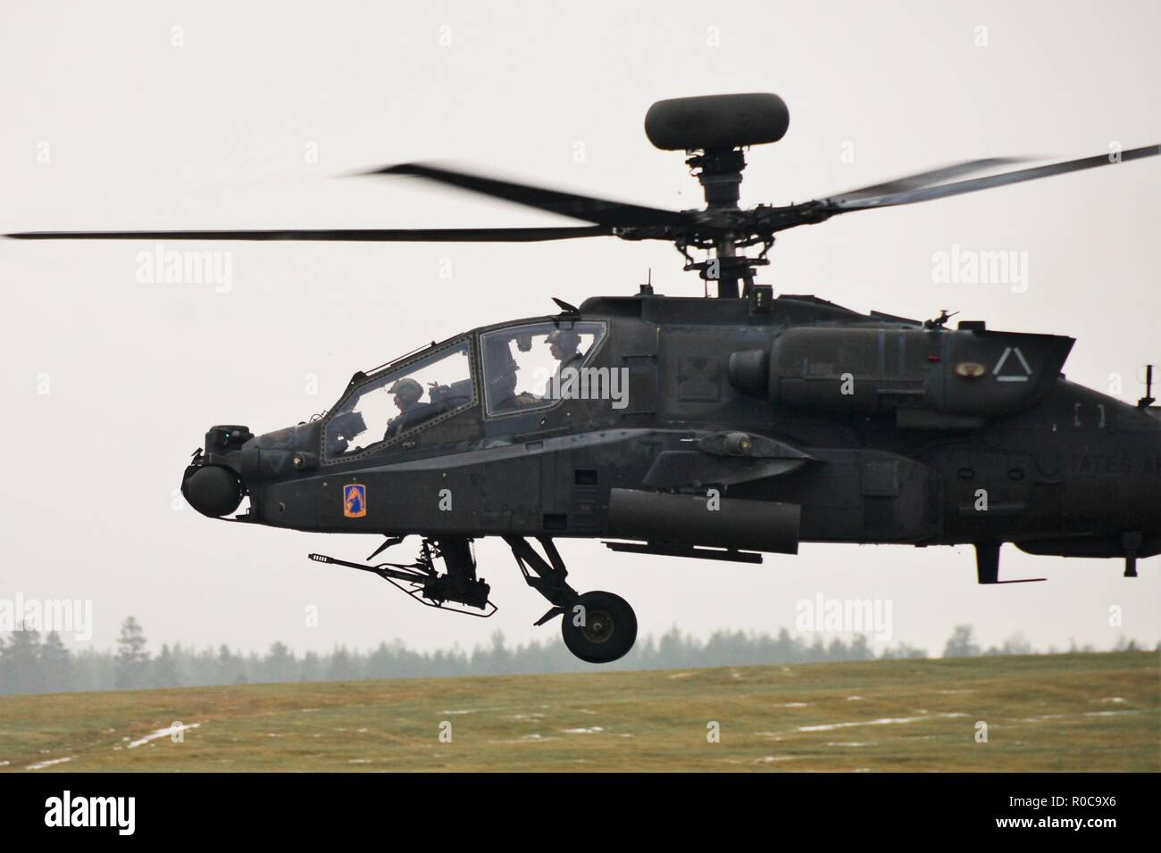 A U.S. Army Apache helicopter assigned to the 1st Battalion, 3rd Aviation Regiment, 12th Combat Aviation Brigade returns to Rena Leir Airfield, Norway, during Trident Juncture 18, Nov. 1, 2018. Trident Juncture is a NATO-led military exercise held in Norway. The exercise is the largest of its kind in Norway since the 1980s. An expected 51,000 participants from over 30 nations will take part, including 10,000 vehicles, 150 aircraft and 60 vessels. The main goals of Trident Juncture is to train the NATO Response Force and to test the alliance's defense capabilities. (U.S. Army photo by Charles R Stock Photo