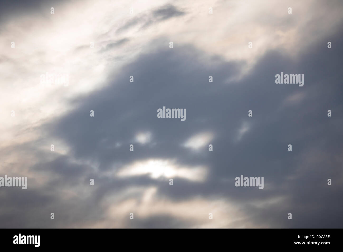 An angry face in the clouds. Stock Photo