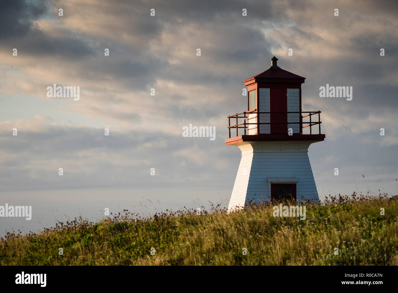 Sunrise view of lighthouse at Cap Alright overlooking Anse Firmin in ...