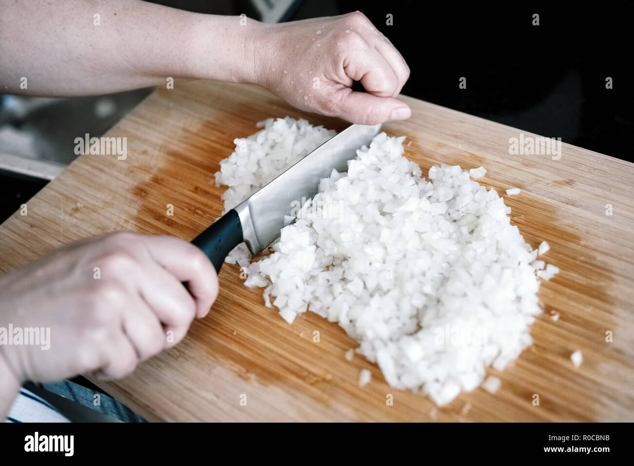 Woman chopping an onion hi-res stock photography and images - Alamy