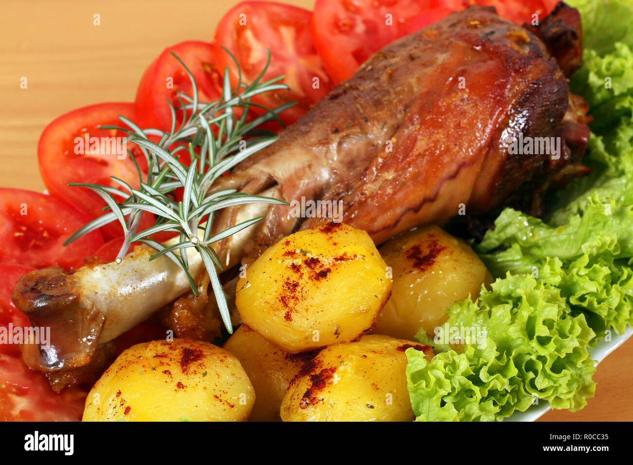 roasted turkey drumstick with potatoes and salad for thanksgiving day Stock Photo