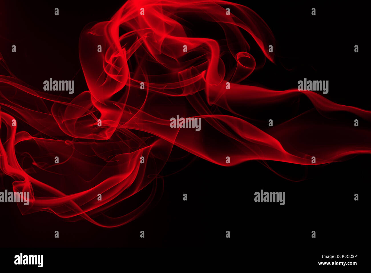 Red smoke abstract on black background, fire design and darkness concept  Stock Photo - Alamy