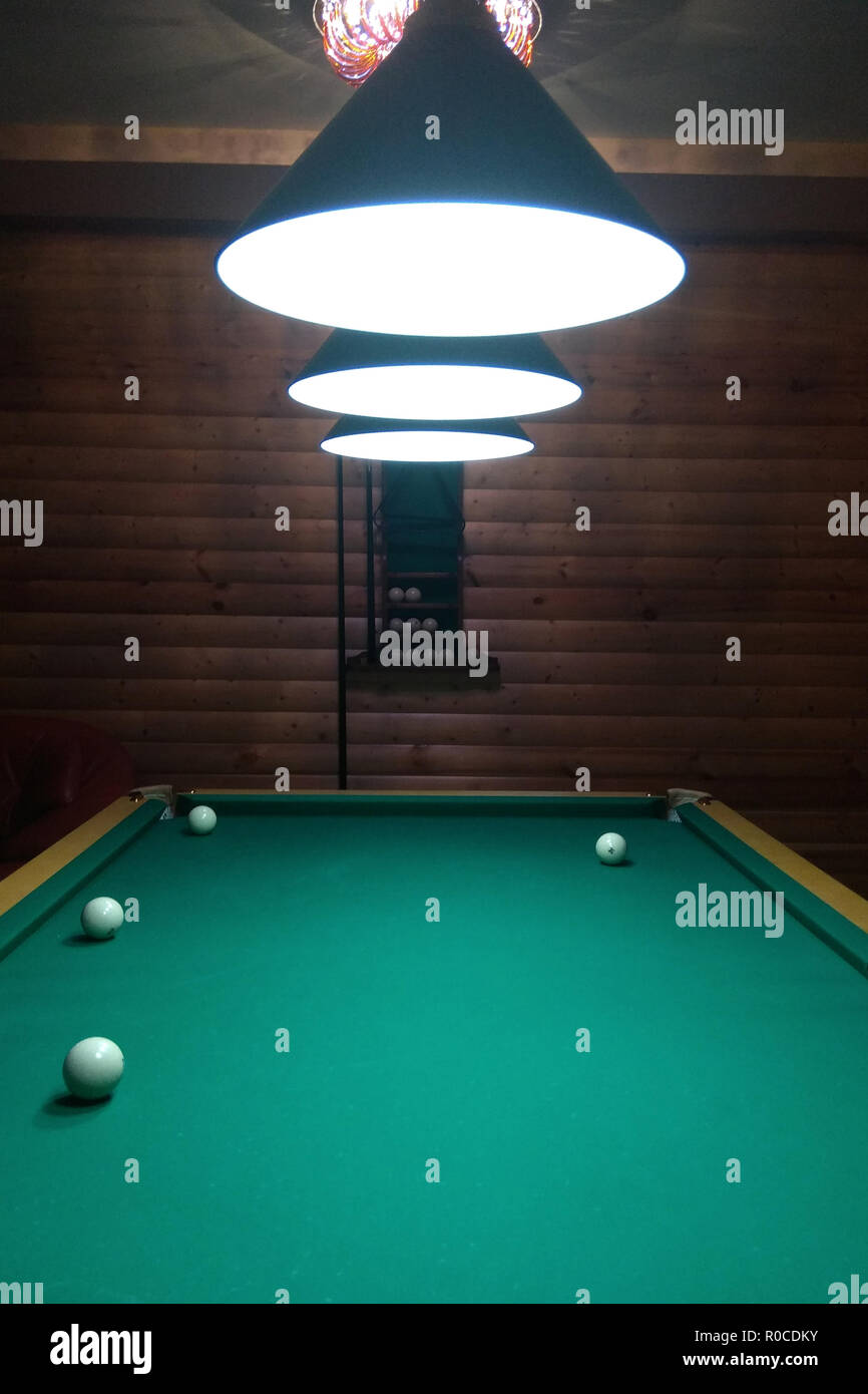 A billiard table has several layers and a cue 2018 Stock Photo