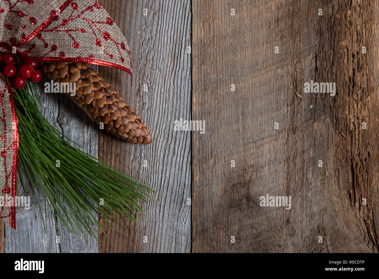 Authentic and rustic Christmas holiday decorations on weathered wood ...