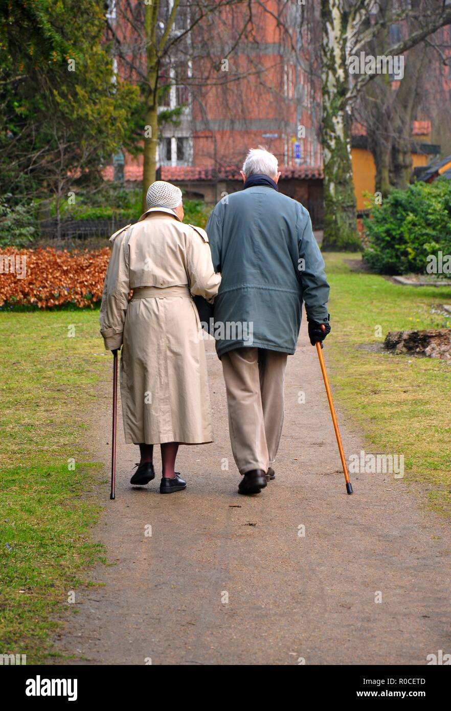 Old couple having a walk in the park Stock Photo - Alamy