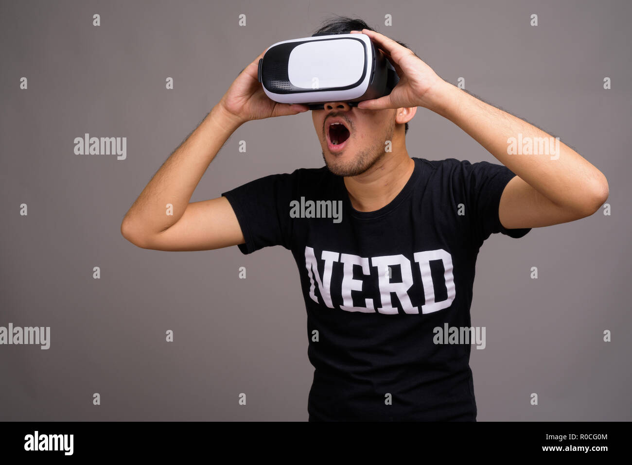 Young asian man using virtual hi-res stock photography and images - Alamy
