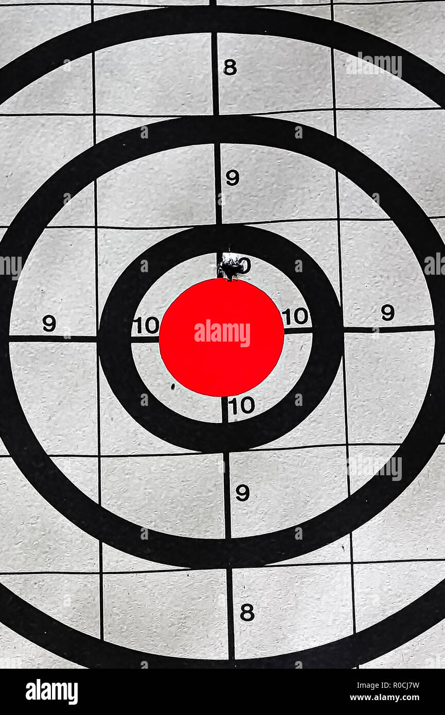 Closeup of a target bullseye with a bullet hole Stock Photo