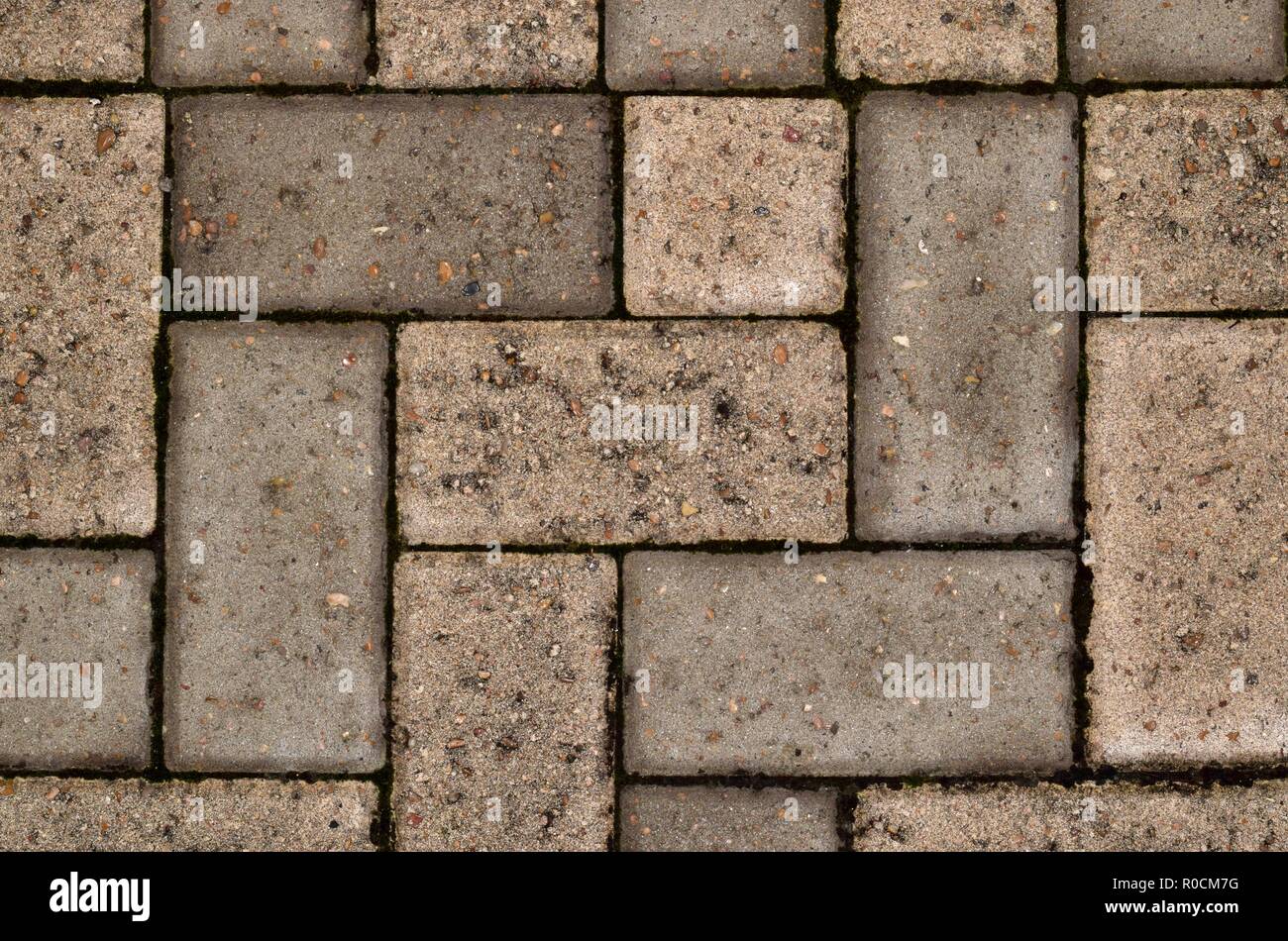 Brown rectangle and square brick paver pattern from an overhead view