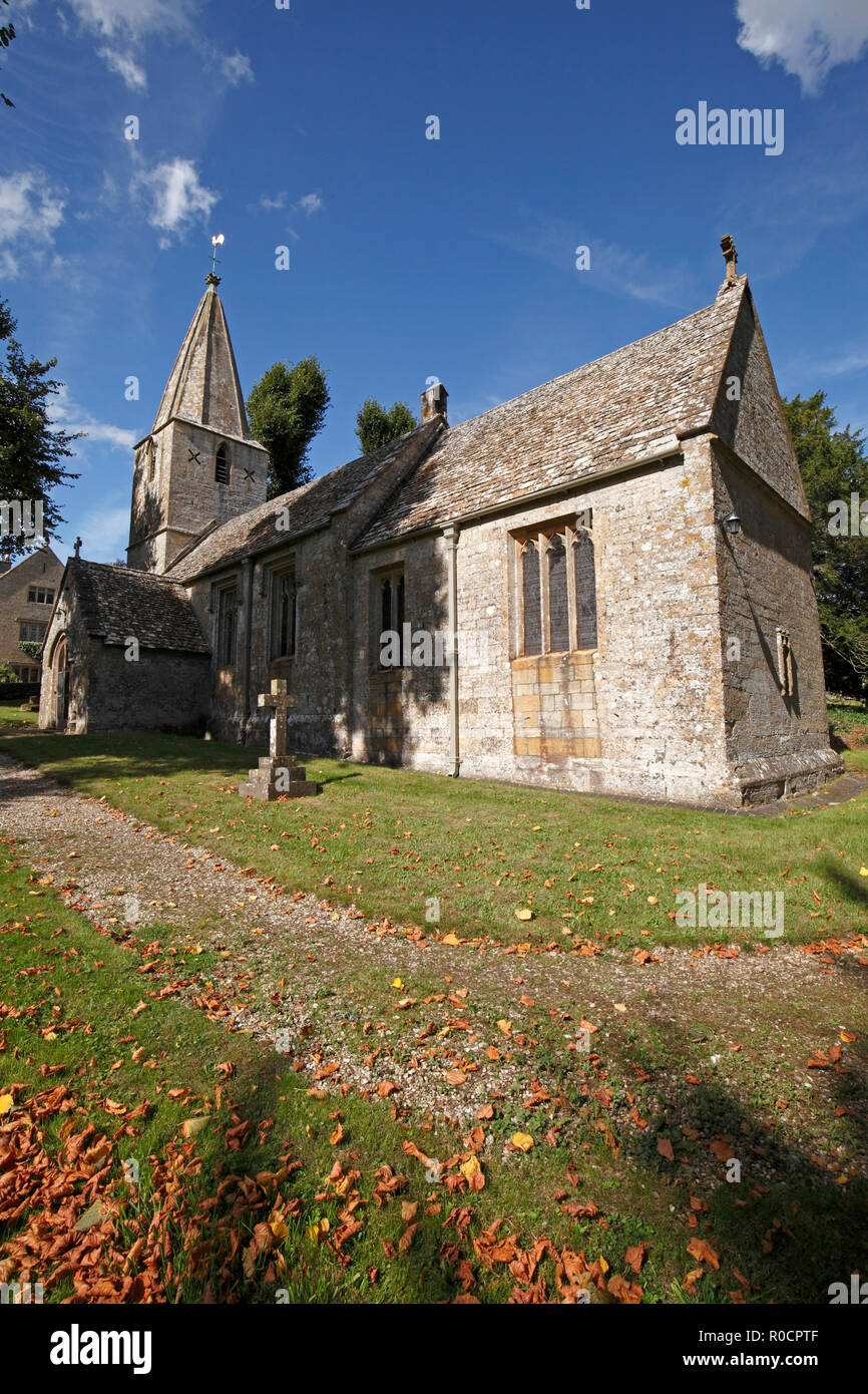 Norman church, St Bartholemew's and the Manor House, Cotswolds village of Notgrove, Gloucestershire Stock Photo