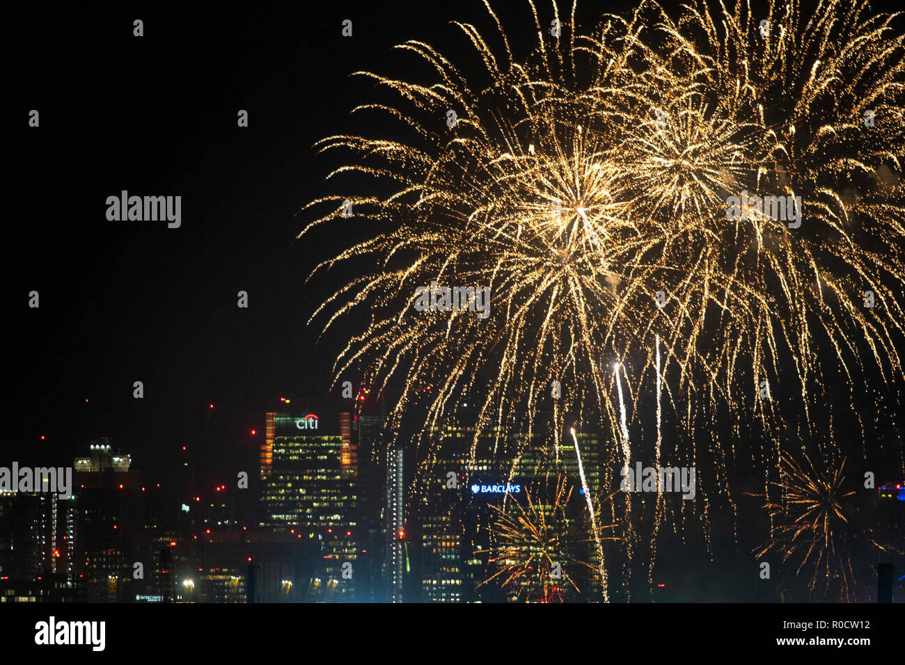 Fireworks over the skyline of Canary Wharf at the Royal Docks, east London. Stock Photo