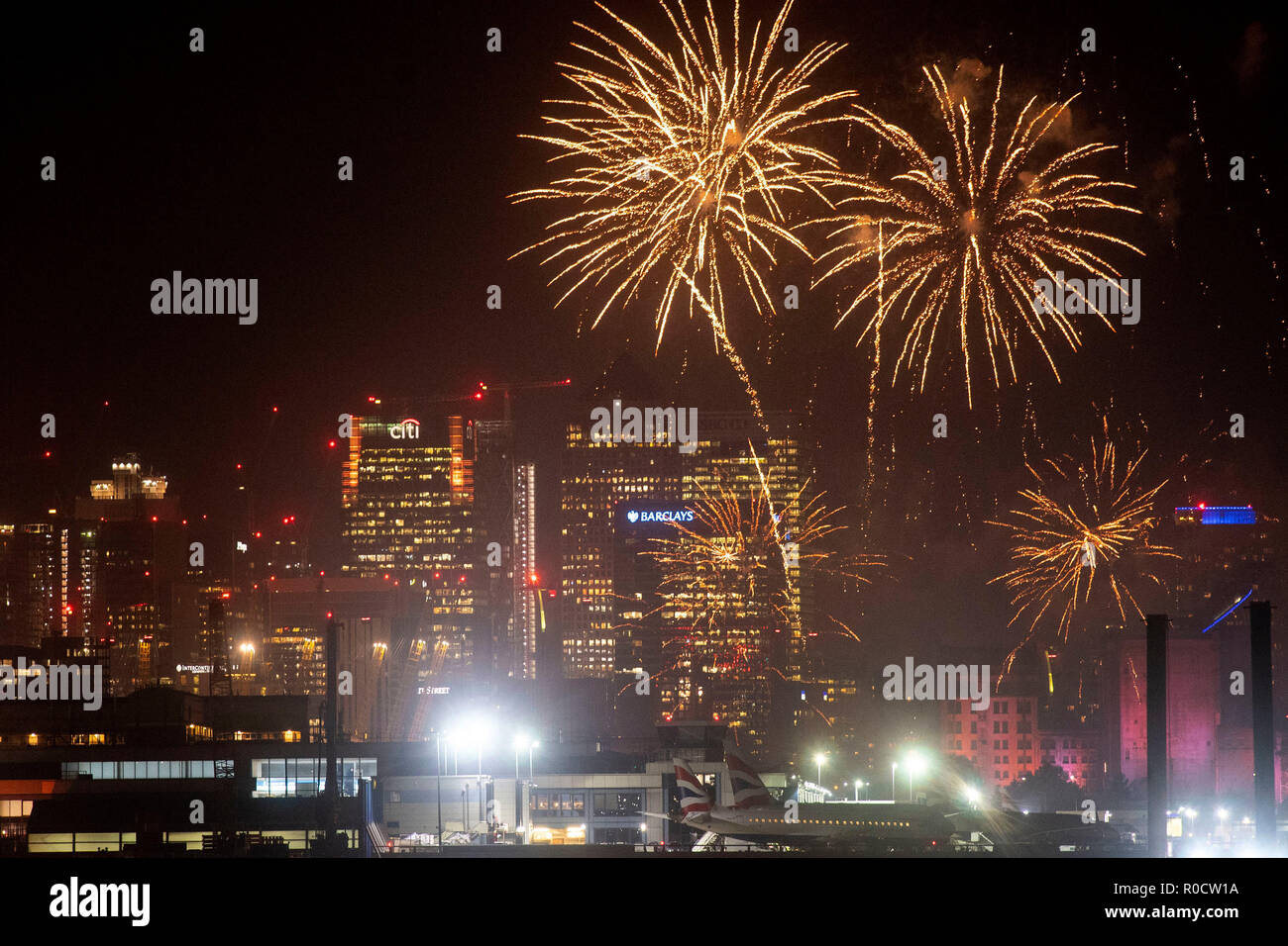 Fireworks over the skyline of Canary Wharf at the Royal Docks, east London. Stock Photo