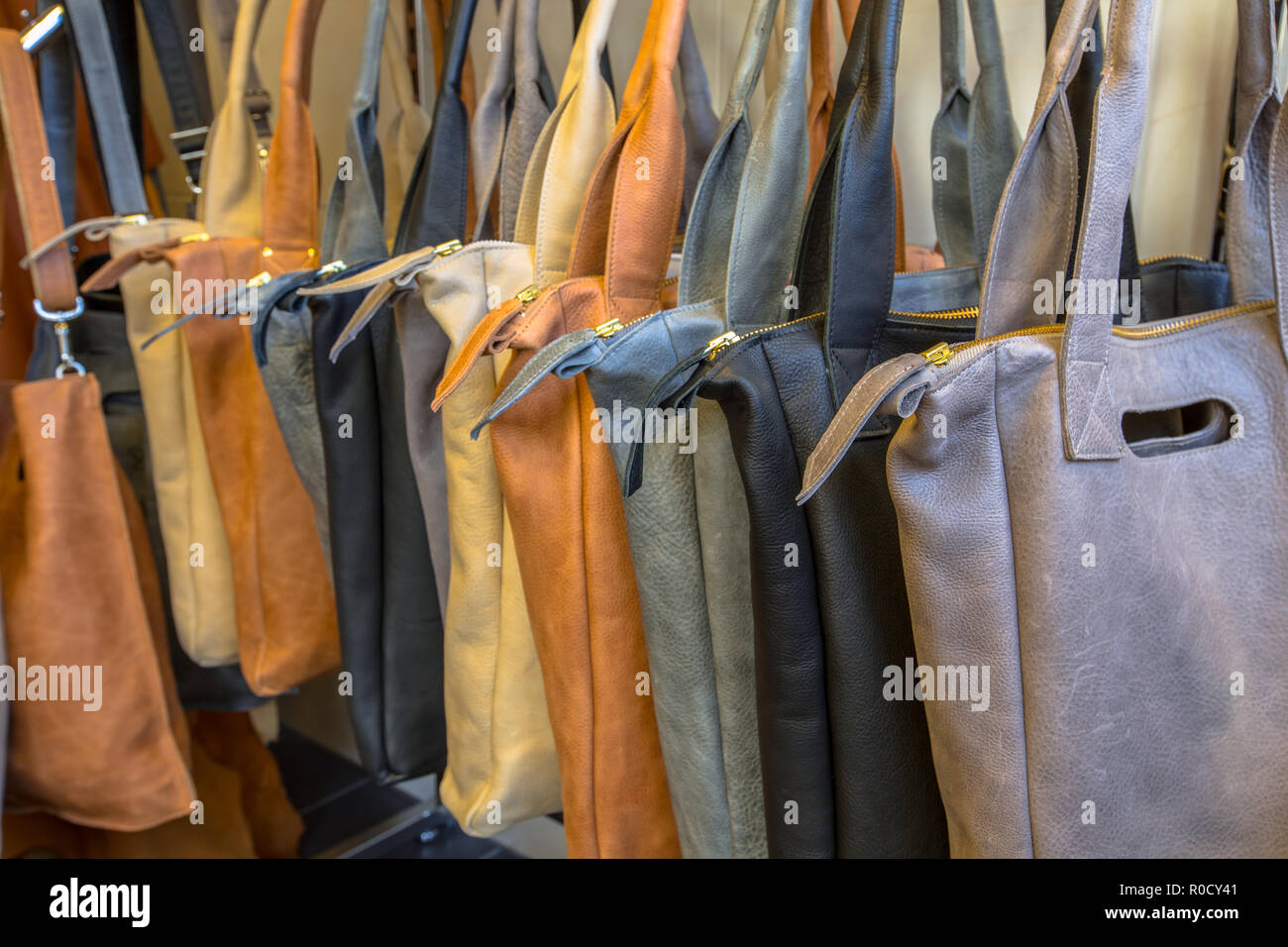 Handmade leather design bags on display in a shop Stock Photo Alamy
