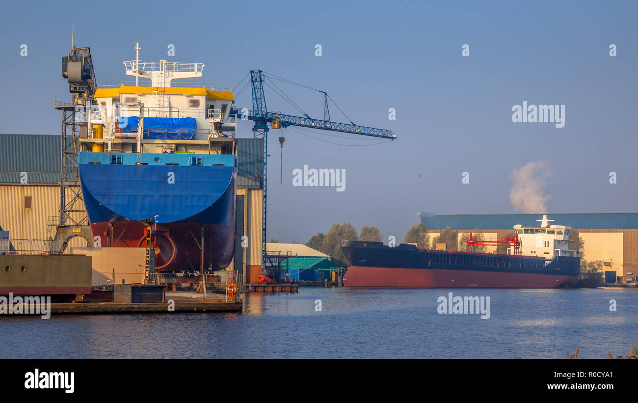 Cargo vessels being Constructed on a small Wharf in the Netherlands Stock Photo