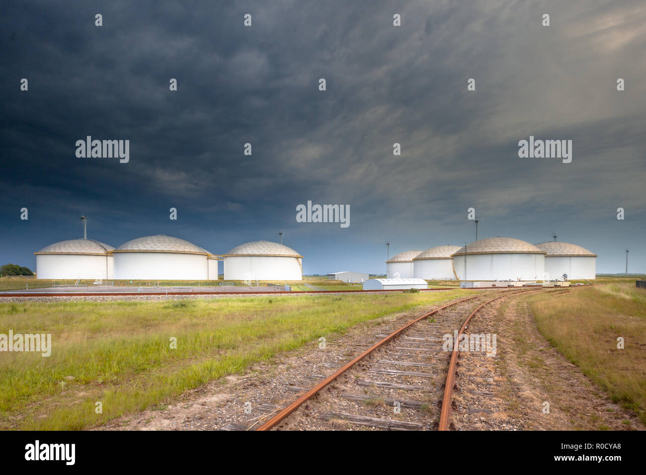 Railroad leading to a huge strategic fuel tank storage teminal in a big harbor in Europe Stock Photo