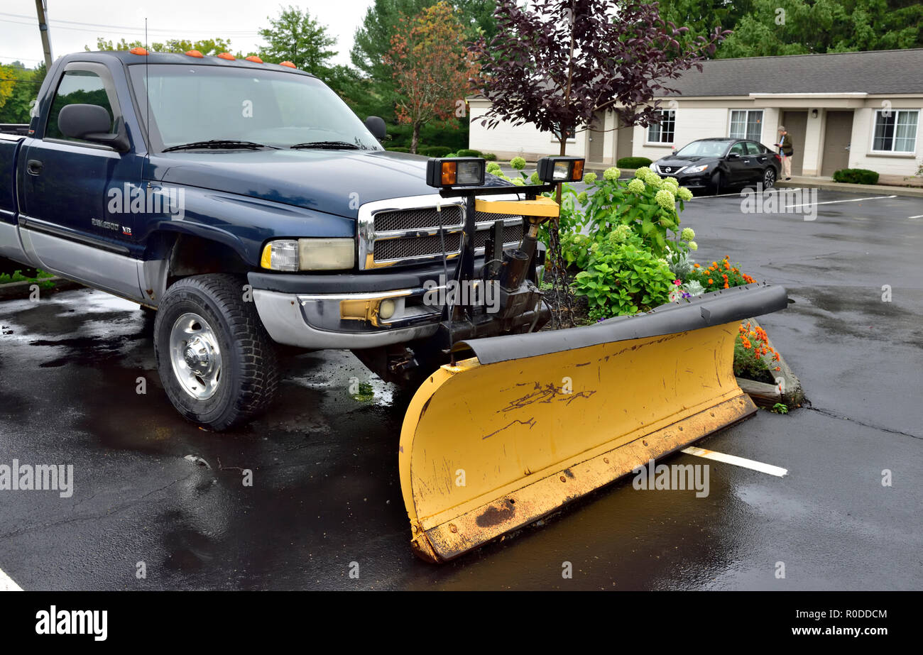 Snow plow mounted on the front of pickup truck getting ready for winter, Albany NY, USA Stock Photo