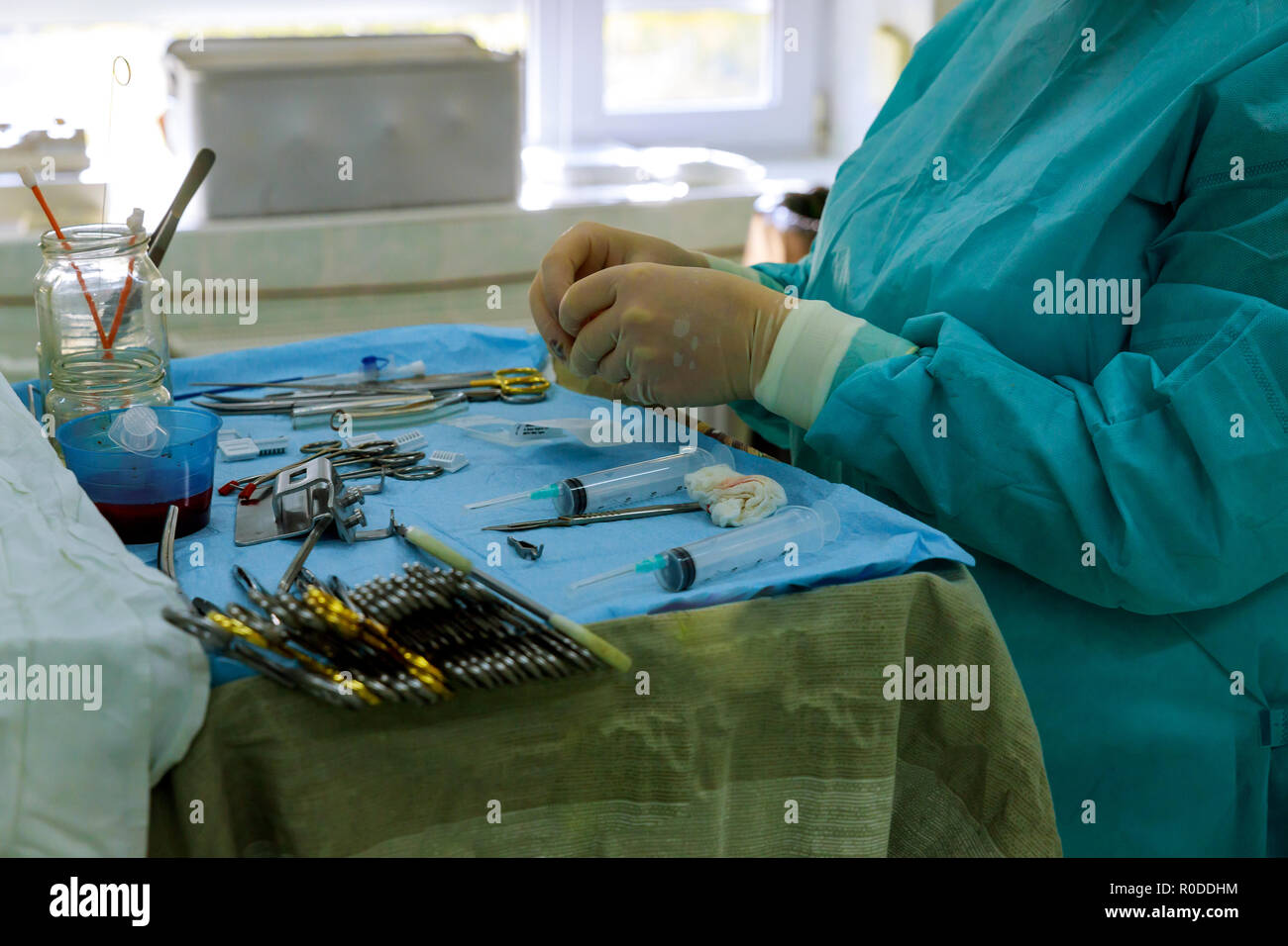 Surgery tools on table with doctor on background Stock Photo